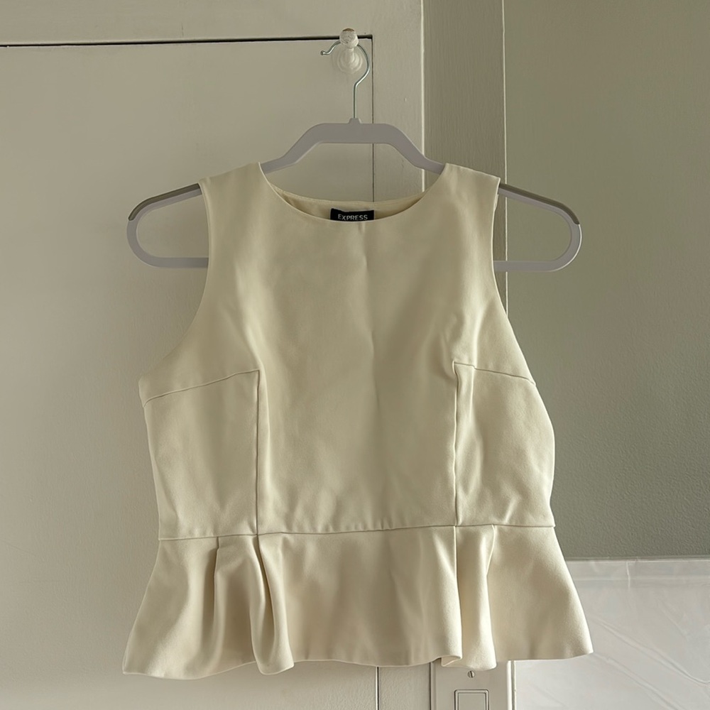 Cream peplum top. Express, size medium.